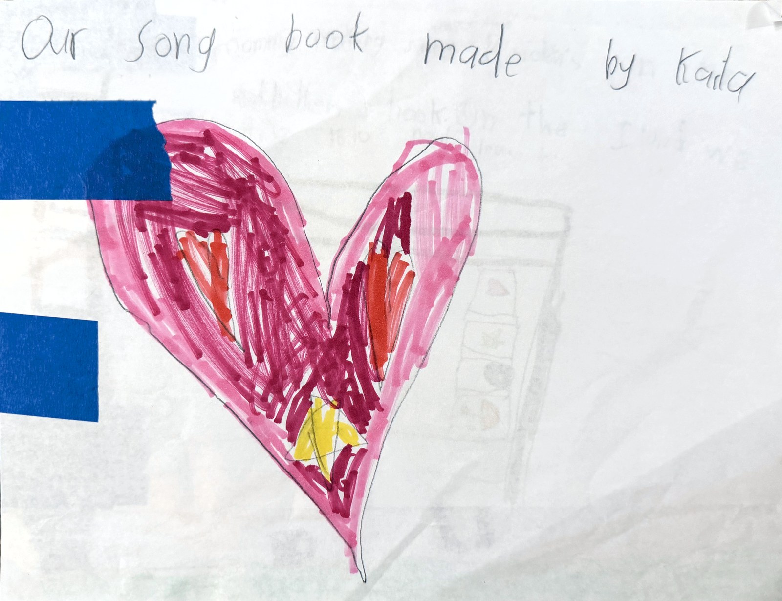 A hand-drawn pink and magenta heart filling a sheet of paper, with the handwritten title Our Song Book made by Kaila